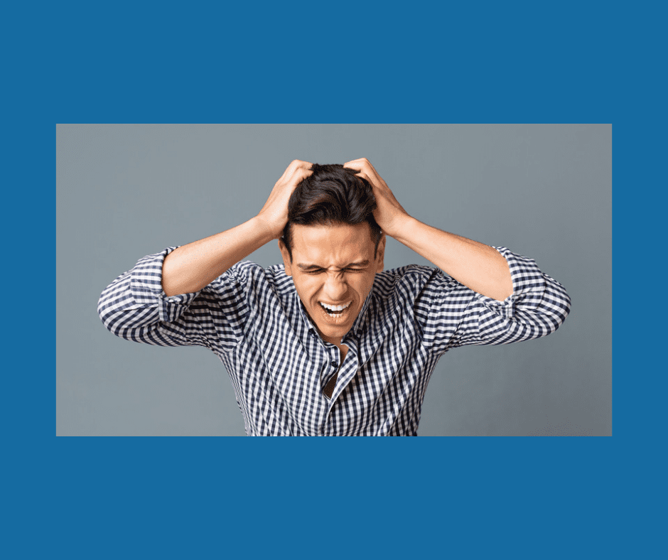 Man pulling hair out after making a mistake