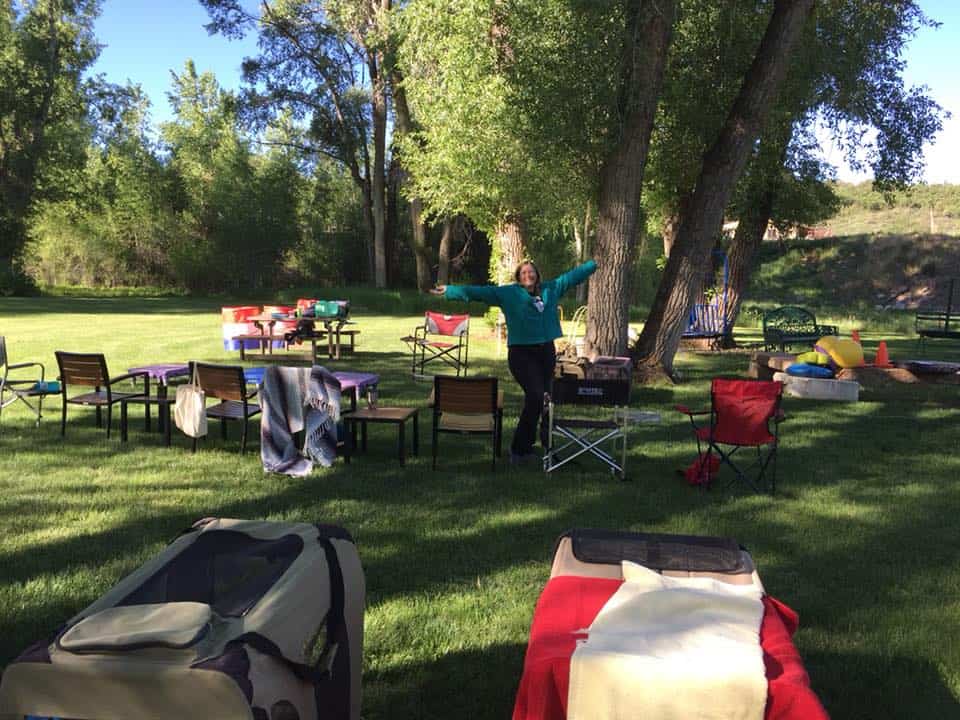 Dog agility instructor preparing for an outdoor seminar